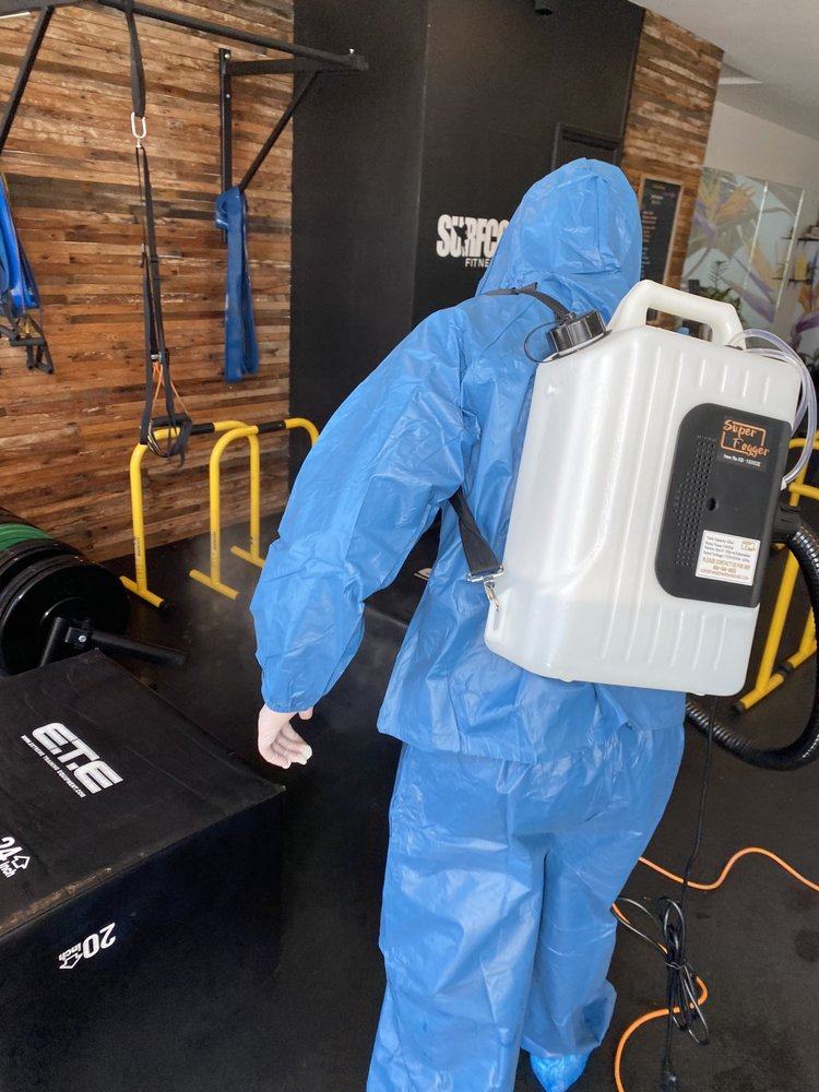 Technician with backpack sprayer